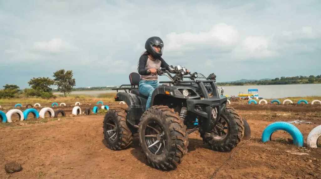 An exciting ATV ride experience for guests at the lakeside camping site of My Adventure Zone in Ananthagiri Hills.