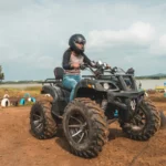 An exciting ATV ride experience for guests at the lakeside camping site of My Adventure Zone in Ananthagiri Hills.