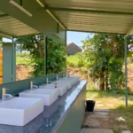 The clean and well-maintained washroom handwash area at the lakeside camping site of My Adventure Zone.