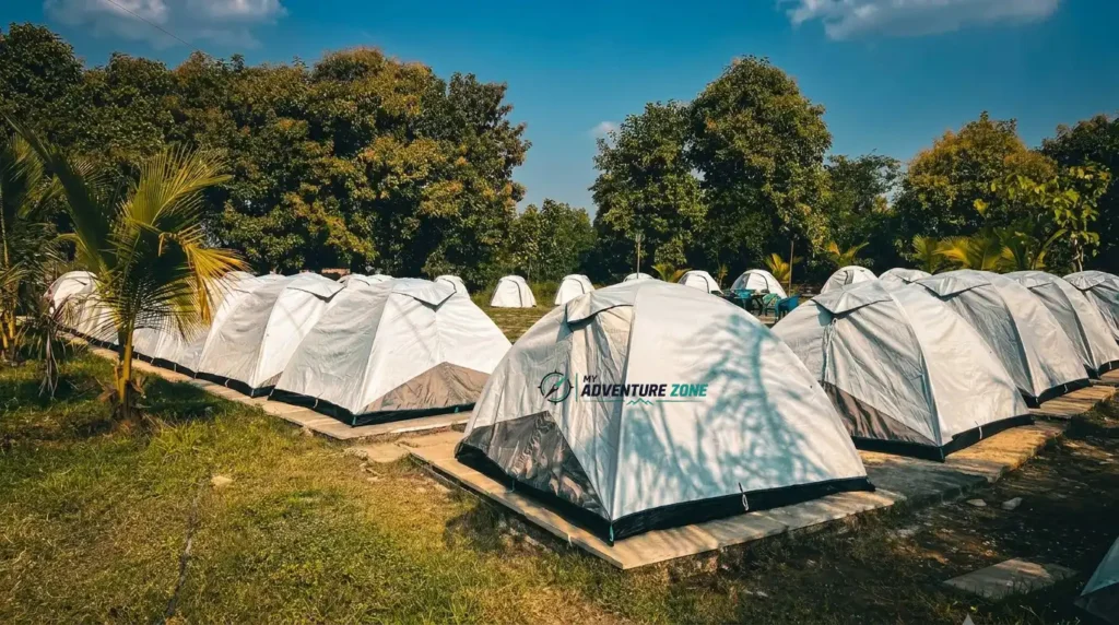 Outdoor tent setup for ananthagiri hills camping surrounded by lush green trees at My Adventure Zone campsite in Vikarabad.